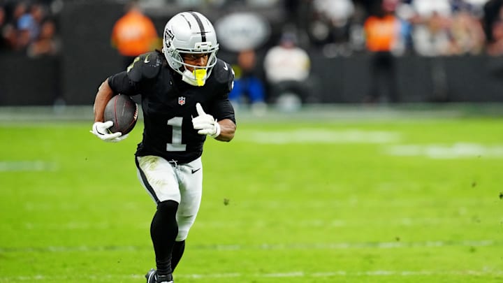 Las Vegas Raiders wide receiver Tre Tucker (1) runs the ball down the field during the second half against the Tennessee Titans at Allegiant Stadium. 