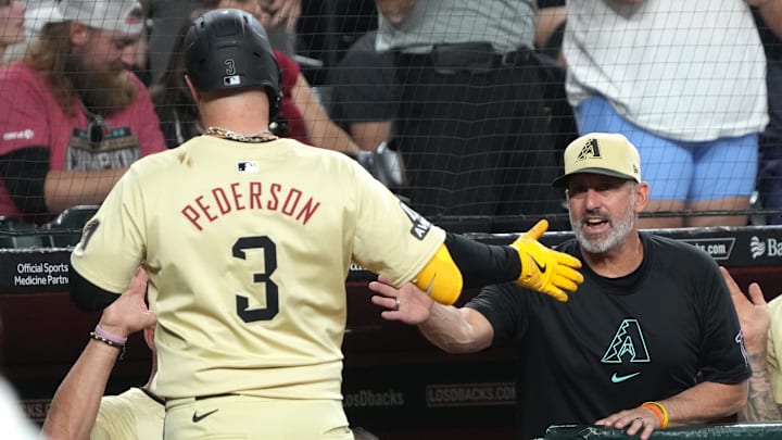 Arizona Diamondbacks designated hitter Joc Pederson (3) celebrates with manager Torey Lovullo (17) after hitting a solo home run against the Texas Rangers in the first inning at Chase Field on Sept 10.