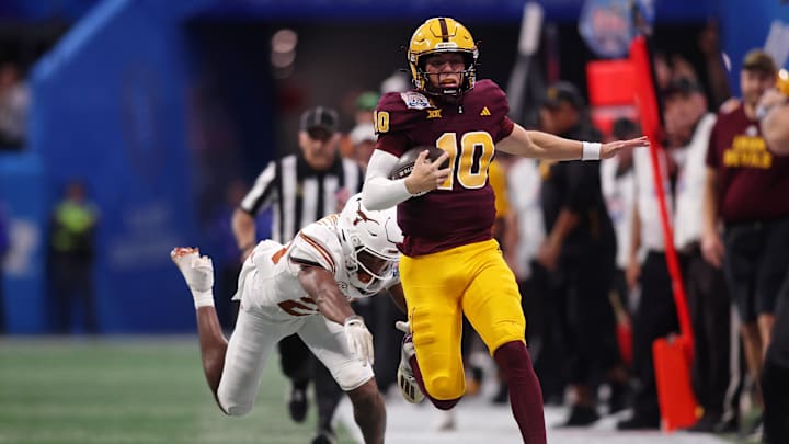 Jan 1, 2025; Atlanta, GA, USA; Arizona State Sun Devils quarterback Sam Leavitt (10) is knocked out of bounds by Texas Longhorns defensive back Jelani McDonald (25) during the second half of the Peach Bowl at Mercedes-Benz Stadium. Mandatory Credit: Brett Davis-Imagn Images