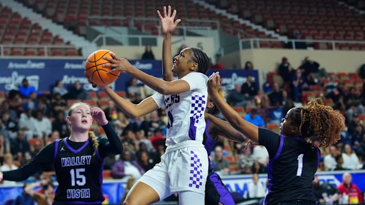Millennium guard Destiny Lunan (11) makes a layup against Valley Vista during the Girls Open State Championship at Veterans Memorial Coliseum in Phoenix on March 8, 2025. Millennium guard Destiny Lunan (11) makes a layup against Valley Vista during the Girls Open State Championship at Veterans Memorial Coliseum in Phoenix on March 8, 2025.