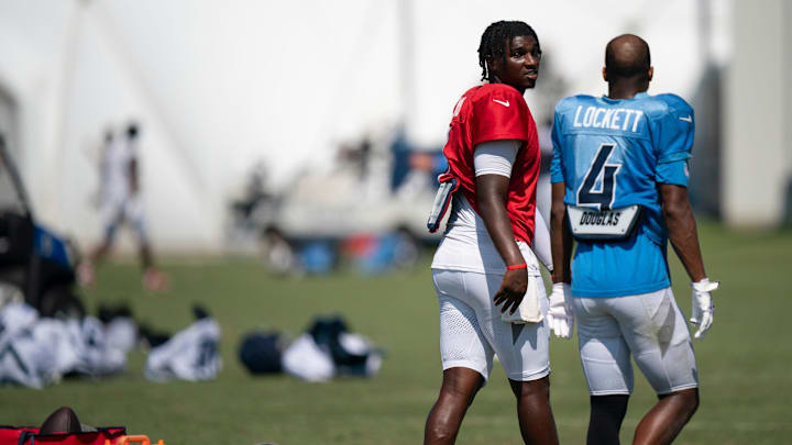 Tennessee Titans quarterback Cam Ward (1) and wide receiver Tyler Lockett (4) work after practice during training camp at Ascension Saint Thomas Sports Park in Nashville, Tenn., Wednesday, July 30, 2025.