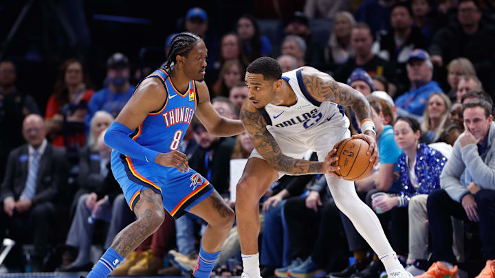 Oklahoma City Thunder forward Jalen Williams defends Dallas Mavericks forward P.J. Washington during the second half at Paycom Center. Mandatory Credit: Alonzo Adams-Imagn Images
