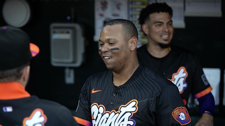 Jun 17, 2025; San Francisco, California, USA; San Francisco Giants designated hitter Rafael Devers (16) greets his new teammates in the dugout before taking on the Cleveland Guardians during the first inning at Oracle Park. Mandatory Credit: D. Ross Cameron-Imagn Images