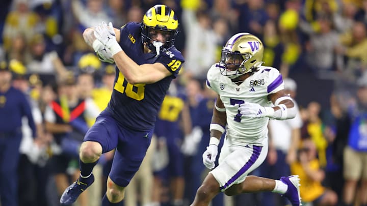 Jan 8, 2024; Houston, TX, USA; Michigan Wolverines tight end Colston Loveland (18) runs with the ball after making a catch against the Washington Huskies during the fourth quarter in the 2024 College Football Playoff national championship game at NRG Stadium. 