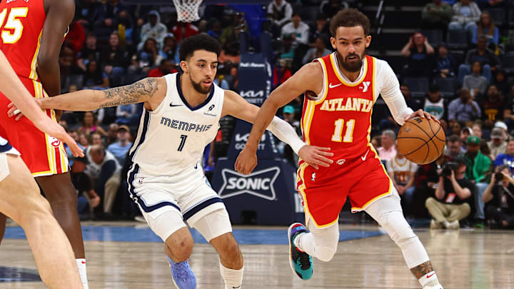 Mar 3, 2025; Memphis, Tennessee, USA; Atlanta Hawks guard Trae Young (11) dribbles as Memphis Grizzlies guard Scotty Pippen Jr. (1) defends during the second quarter at FedExForum. Mandatory Credit: Petre Thomas-Imagn Images