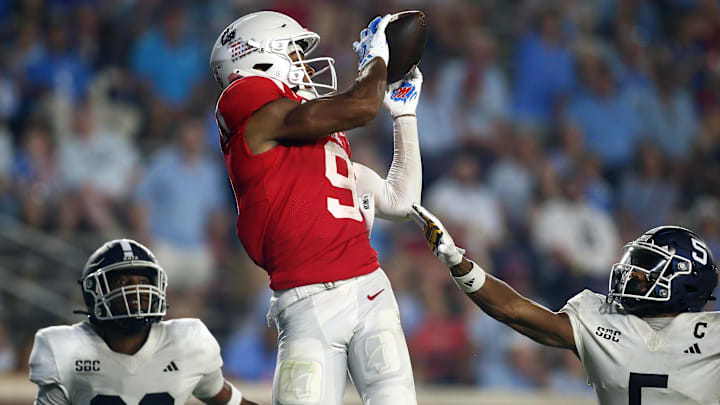 Sep 21, 2024; Oxford, Mississippi, USA; Mississippi Rebels wide receiver Tre Harris (9) catches the ball for a touchdown.