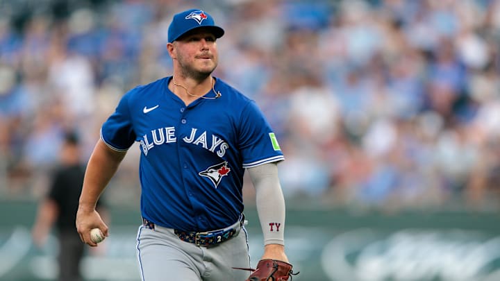 Sep 20, 2025; Kansas City, Missouri, USA;  Toronto Blue Jays first base Ty France (2) heads to the dugout after the first inning against the Kansas City Royals at Kauffman Stadium. Mandatory Credit: William Purnell-Imagn Images
