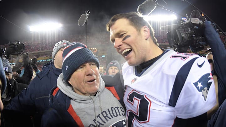New England Patriots quarterback Tom Brady celebrates with coach Bill Belichick 