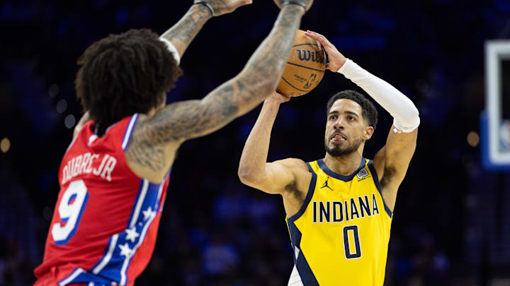Dec 13, 2024; Philadelphia, Pennsylvania, USA; Indiana Pacers guard Tyrese Haliburton (0) shoots the bal in front of Philadelphia 76ers guard Kelly Oubre Jr. (9) during the second quarter at Wells Fargo Center. Mandatory Credit: Bill Streicher-Imagn Images