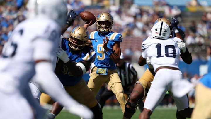 Oct 4, 2025; Pasadena, California, USA;  UCLA Bruins quarterback Nico Iamaleava (9) looks to pass during the first quarter against the Penn State Nittany Lions at Rose Bowl. Mandatory Credit: Kiyoshi Mio-Imagn Images
