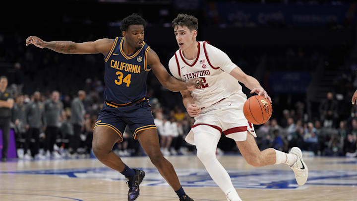 Mar 12, 2025; Charlotte, NC, USA; Stanford Cardinal forward Maxime Raynaud (42) drives to the basket against California Golden Bears forward Lee Dort (34) during the second half at Spectrum Center. Mandatory Credit: Jim Dedmon-Imagn Images
