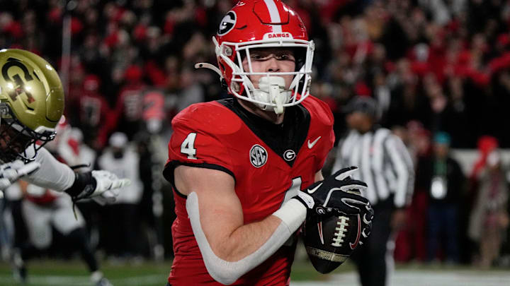 Georgia tight end Oscar Delp (4) scores a touchdown during the second half of a NCAA college football game against Georgia Tech in Athens, Ga., on Friday, Nov. 29, 2024. Georgia tight end Oscar Delp (4) scores a touchdown during the second half of a NCAA college football game against Georgia Tech in Athens, Ga., on Friday, Nov. 29, 2024.