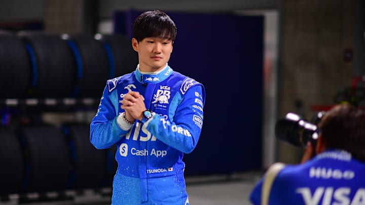 Nov 20, 2024; Las Vegas, Nevada, USA; Visa Cash App RB driver Yuki Tsunoda (22) poses for photos at Las Vegas Circuit. Mandatory Credit: Gary A. Vasquez-Imagn Images
