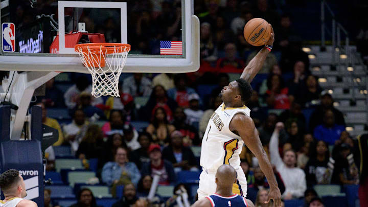 Mar 11, 2025; New Orleans, Louisiana, USA; New Orleans Pelicans forward Zion Williamson (1) dunks against Los Angeles Clippers guard Kris Dunn (8) during the second half at Smoothie King Center. Mandatory Credit: Matthew Hinton-Imagn Images