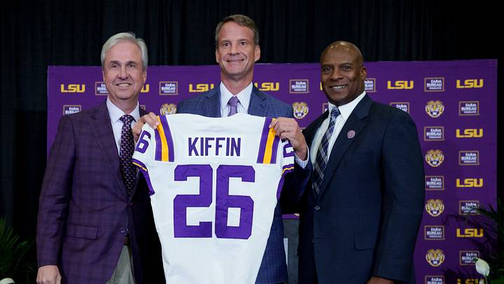 Dec 1, 2025; Baton Rouge, LA, USA; LSU president Wade Rousse, left, LSU new head coach Lane Kiffin and LSU athletic director Verge Ausberry stand together at South Stadium Club at Tiger Stadium. Mandatory Credit: Matthew Hinton-Imagn Images Dec 1, 2025; Baton Rouge, LA, USA; LSU president Wade Rousse, left, LSU new head coach Lane Kiffin and LSU athletic director Verge Ausberry stand together at South Stadium Club at Tiger Stadium. Mandatory Credit: Matthew Hinton-Imagn Images