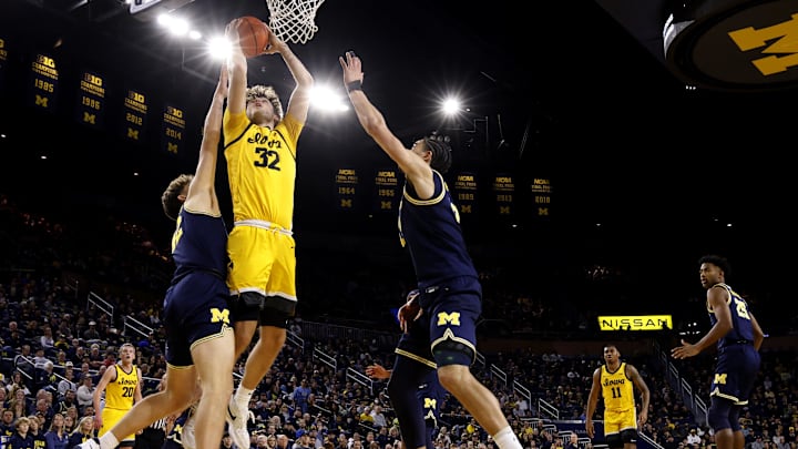 Jan 27, 2024; Ann Arbor, Michigan, USA; Iowa Hawkeyes forward Owen Freeman (32) is defended by