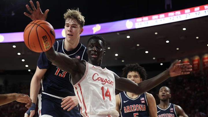 Feb 21, 2026; Houston, Texas, USA; Houston Cougars forward Kalifa Sakho (14) and Arizona Wildcats center Motiejus Krivas (13) fight over a rebound in the second half at Fertitta Center. Mandatory Credit: Thomas Shea-Imagn Images Feb 21, 2026; Houston, Texas, USA; Houston Cougars forward Kalifa Sakho (14) and Arizona Wildcats center Motiejus Krivas (13) fight over a rebound in the second half at Fertitta Center. Mandatory Credit: Thomas Shea-Imagn Images
