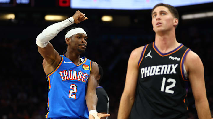 Apr 27, 2026; Phoenix, Arizona, USA; Oklahoma City Thunder guard Shai Gilgeous-Alexander (2) celebrates a three point shot against Phoenix Suns guard Collin Gillespie (12) in the first half during game four of the first round of the 2026 NBA Playoffs at Mortgage Matchup Center. Mandatory Credit: Mark J. Rebilas-Imagn Images