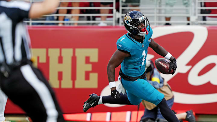 Sep 28, 2025; Santa Clara, California, USA; Jacksonville Jaguars running back Travis Etienne Jr. (1) scores a touchdown during the second half against the San Francisco 49ers at Levi's Stadium. Mandatory Credit: Darren Yamashita-Imagn Images Sep 28, 2025; Santa Clara, California, USA; Jacksonville Jaguars running back Travis Etienne Jr. (1) scores a touchdown during the second half against the San Francisco 49ers at Levi's Stadium. Mandatory Credit: Darren Yamashita-Imagn Images