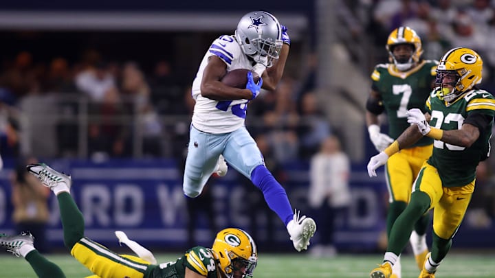 Jan 14, 2024; Arlington, Texas, USA; Dallas Cowboys wide receiver Michael Gallup (13) makes a catch over Green Bay Packers safety Jonathan Owens (34) during the second half of the 2024 NFC wild card game at AT&T Stadium. Mandatory Credit: Tim Heitman-USA TODAY Sports Jan 14, 2024; Arlington, Texas, USA; Dallas Cowboys wide receiver Michael Gallup (13) makes a catch over Green Bay Packers safety Jonathan Owens (34) during the second half of the 2024 NFC wild card game at AT&T Stadium. Mandatory Credit: Tim Heitman-USA TODAY Sports