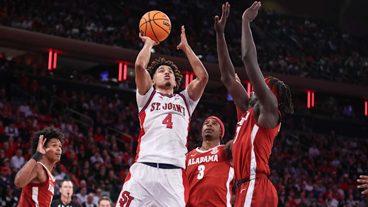Nov 8, 2025; New York, New York, USA; St. John's basketball guard Oziyah Sellers (4) looks to drive past Alabama Crimson Tide forward Taylor Bol Bowen (7) in the second half at Madison Square Garden. Nov 8, 2025; New York, New York, USA; St. John's basketball guard Oziyah Sellers (4) looks to drive past Alabama Crimson Tide forward Taylor Bol Bowen (7) in the second half at Madison Square Garden.
