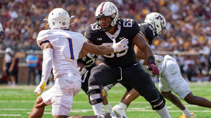 Sep 10, 2022; Minneapolis, Minnesota, USA; Minnesota Golden Gophers offensive lineman Aireontae Ersery (69) blocks Western Illinois Leathernecks defensive back JJ Ross (1) in the second quarter at Huntington Bank Stadium.
