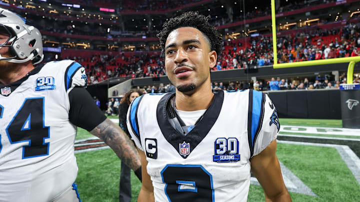 Jan 5, 2025; Atlanta, Georgia, USA; Carolina Panthers quarterback Bryce Young (9) celebrates with teammates after a victory over the Atlanta Falcons in overtime at Mercedes-Benz Stadium. Mandatory Credit: Brett Davis-Imagn Images