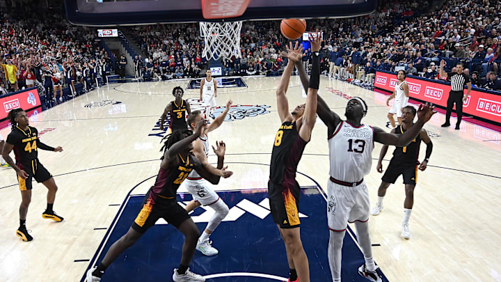 Nov 10, 2024; Spokane, Washington, USA; Gonzaga Bulldogs forward Graham Ike (13) rebounds the ball against Arizona State Sun Devils forward Basheer Jihad (8) in the first half at McCarthey Athletic Center. Gonzaga Bulldogs won 88-80. Mandatory Credit: James Snook-Imagn Images