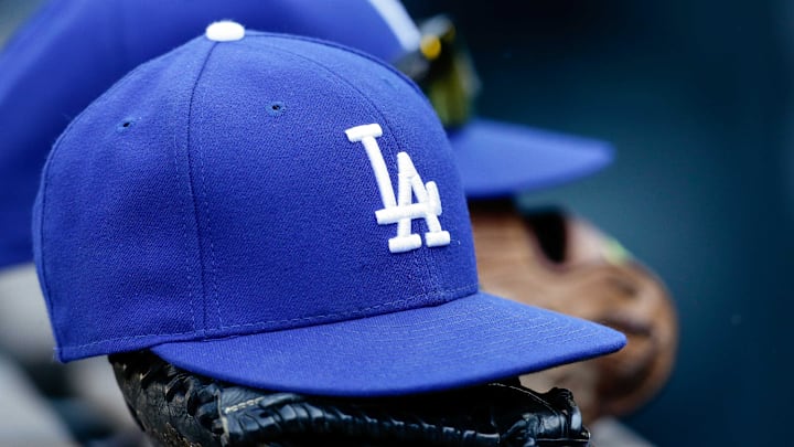 Apr 9, 2017; Denver, CO, USA; A general view of a Los Angeles Dodgers hat and glove on the bench in the seventh inning of the game against the Colorado Rockies at Coors Field. Mandatory Credit: Isaiah J. Downing-Imagn Images Apr 9, 2017; Denver, CO, USA; A general view of a Los Angeles Dodgers hat and glove on the bench in the seventh inning of the game against the Colorado Rockies at Coors Field. Mandatory Credit: Isaiah J. Downing-Imagn Images