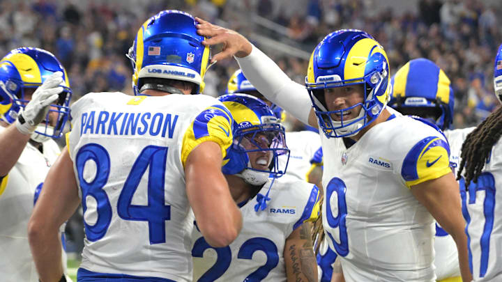 Nov 23, 2025; Inglewood, California, USA; Los Angeles Rams tight end Colby Parkinson (84) is congratulated by quarterback Matthew Stafford (9) after catching a touchdown pass against the Tampa Bay Buccaneers at SoFi Stadium. Mandatory Credit: Jayne Kamin-Oncea-Imagn Images