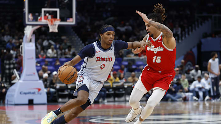 Dec 8, 2024; Washington, District of Columbia, USA; Washington Wizards guard Bilal Coulibaly (0) drives to the basket as Memphis Grizzlies forward Brandon Clarke (15) in the first quarter at Capital One Arena. Mandatory Credit: Geoff Burke-Imagn Images