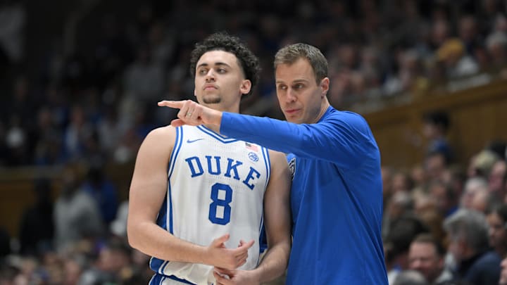 Mar 1, 2025; Durham, North Carolina, USA;  Duke Blue Devils head coach Jon Scheyer directs Duke Blue Devils guard Darren Harris (8) during the second half at Cameron Indoor Stadium. Mandatory Credit: Zachary Taft-Imagn Images