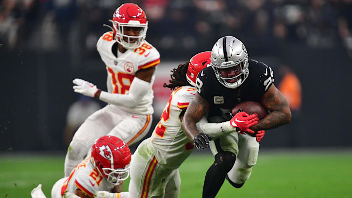 Jan 7, 2023; Paradise, Nevada, USA; Las Vegas Raiders running back Josh Jacobs (28) is brought down