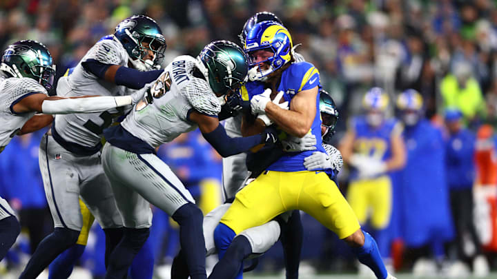Dec 18, 2025; Seattle, Washington, USA; Seattle Seahawks safety Coby Bryant (8) tackles Los Angeles Rams wide receiver Jordan Whittington (88) in the first half at Lumen Field. Mandatory Credit: Kevin Ng-Imagn Images