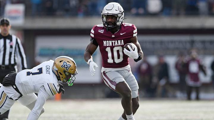 Montana Grizzlies running back Eli Gillman (10) carries the ball against the Montana State Bobcats