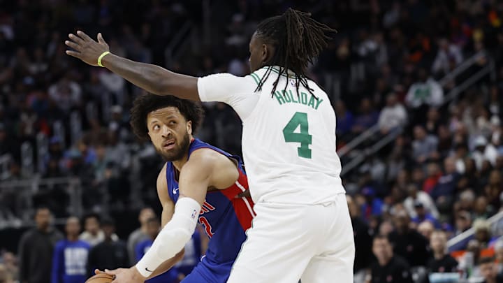 Feb 26, 2025; Detroit, Michigan, USA; Detroit Pistons guard Cade Cunningham (2) is defended by Boston Celtics guard Jrue Holiday (4) in the second half at Little Caesars Arena. Mandatory Credit: Rick Osentoski-Imagn Images Feb 26, 2025; Detroit, Michigan, USA; Detroit Pistons guard Cade Cunningham (2) is defended by Boston Celtics guard Jrue Holiday (4) in the second half at Little Caesars Arena. Mandatory Credit: Rick Osentoski-Imagn Images