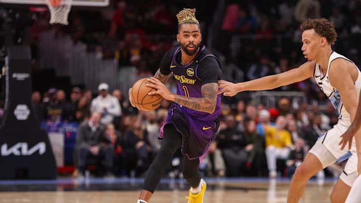 Dec 6, 2024; Atlanta, Georgia, USA; Los Angeles Lakers guard D'Angelo Russell (1) dribbles against the Atlanta Hawks in the second quarter at State Farm Arena. Mandatory Credit: Brett Davis-Imagn Images