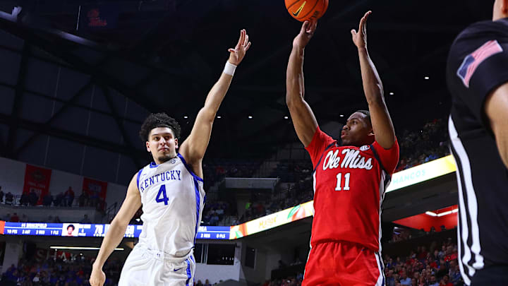 Feb 4, 2025; Oxford, Mississippi, USA; Mississippi Rebels guard Matthew Murrell (11) shoots a three point basket as Kentucky Wildcats guard Koby Brea (4) defends during the second half at The Sandy and John Black Pavilion at Ole Miss. Mandatory Credit: Petre Thomas-Imagn Images Feb 4, 2025; Oxford, Mississippi, USA; Mississippi Rebels guard Matthew Murrell (11) shoots a three point basket as Kentucky Wildcats guard Koby Brea (4) defends during the second half at The Sandy and John Black Pavilion at Ole Miss. Mandatory Credit: Petre Thomas-Imagn Images