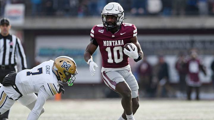 Montana running back Eli Gillman (10) carries the ball against the Montana State Bobcats Montana running back Eli Gillman (10) carries the ball against the Montana State Bobcats