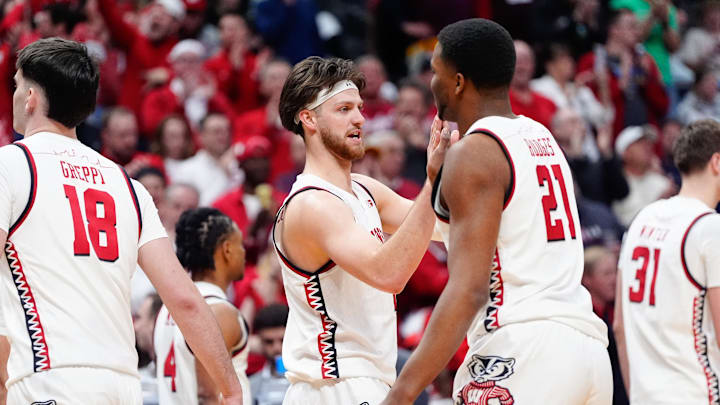 Mar 20, 2025; Denver, CO, USA; Wisconsin Badgers forward Carter Gilmore (7) celebrates after defeating the Montana Grizzlies in the first round of the NCAA Tournament at Ball Arena. Mandatory Credit: Ron Chenoy-Imagn Images