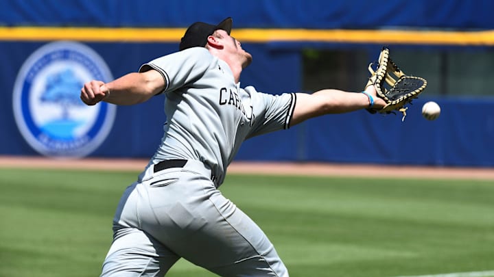 May 21 2024; Hoover, AL, USA; South Carolina first baseman Ethan Petry can’t reach a tricky pop up behind first in foul territory during the game with Alabama at the Hoover Met on the opening day of the SEC Tournament.