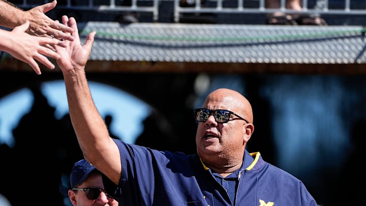 Michigan athletic director Warde Manuel high-fives fans as he walks down the tunnel for warm up before the USC game at Michigan Stadium in Ann Arbor on Saturday, Sept. 21, 2024.