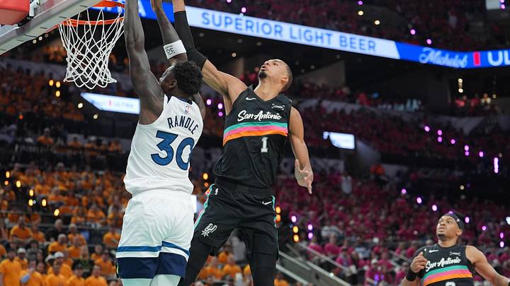 May 4, 2026; San Antonio, Texas, USA; Minnesota Timberwolves forward Julius Randle (30) shoots against San Antonio Spurs forward Victor Wembanyama (1) in the first half during game one of the second round of the 2026 NBA Playoffs at Frost Bank Center. Mandatory Credit: Daniel Dunn-Imagn Images