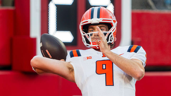Sep 20, 2024; Lincoln, Nebraska, USA; Illinois Fighting Illini quarterback Luke Altmyer (9) warms up before a game against the Nebraska Cornhuskers at Memorial Stadium. Mandatory Credit: Dylan Widger-Imagn Images