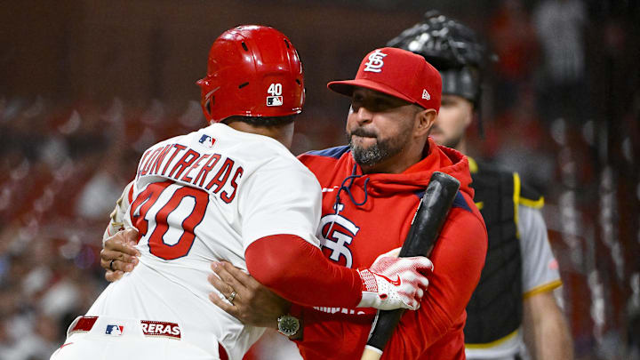 Aug 25, 2025; St. Louis, Missouri, USA;  St. Louis Cardinals designated hitter Willson Contreras (40) is held back by manager Oliver Marmol (37) after he was ejected by umpire Derek Thomas (not pictured) during the seventh inning against the Pittsburgh Pirates at Busch Stadium. Mandatory Credit: Jeff Curry-Imagn Images