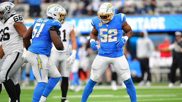 Oct 1, 2023; Inglewood, California, USA; Los Angeles Chargers linebacker Khalil Mack (52) reacts after sacking Las Vegas Raiders quarterback Aidan O'Connell (4) with defensive tackle Sebastian Joseph-Day (51) during the second half at SoFi Stadium. Mandatory Credit: Gary A. Vasquez-USA TODAY Sports