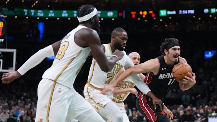 Dec 19, 2025; Boston, Massachusetts, USA; Miami Heat forward Jaime Jaquez Jr. (11) drives the ball against Boston Celtics guard Jaylen Brown (7) in the first quarter at TD Garden. Mandatory Credit: David Butler II-Imagn Images