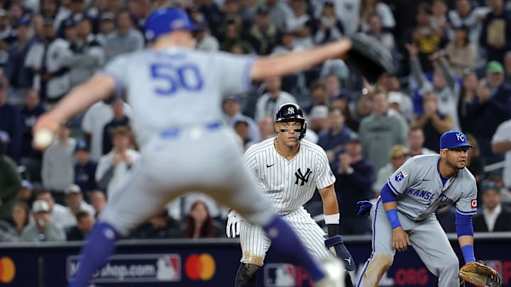 Oct 7, 2024; Bronx, New York, USA; New York Yankees outfielder Aaron Judge (99) leads off first base as Kansas City Royals pitcher Kris Bubic (50) throws a pitch in the eighth inning during game two of the ALDS for the 2024 MLB Playoffs at Yankee Stadium. Mandatory Credit: Brad Penner-Imagn Images