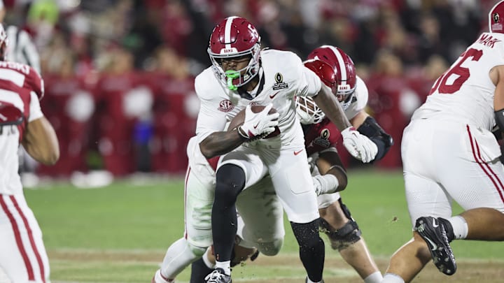 Dec 19, 2025; Norman, OK, USA; Alabama Crimson Tide wide receiver Germie Bernard (5) runs the ball in the second half against the Oklahoma Sooners at Gaylord Family OK Memorial Stadium. Mandatory Credit: Nelson Chenault-Imagn Images