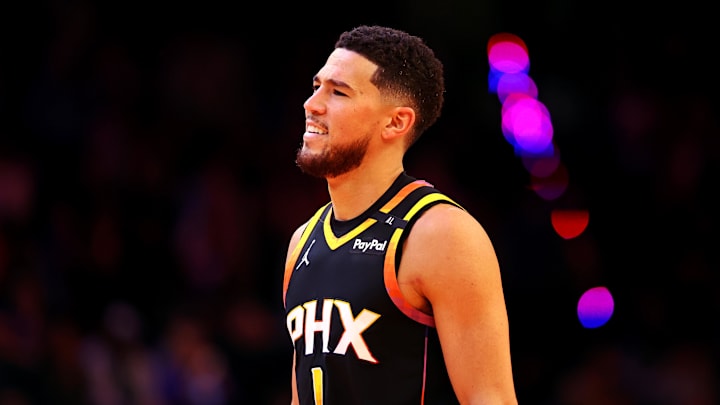Nov 26, 2024; Phoenix, Arizona, USA; Phoenix Suns guard Devin Booker (1) reacts during the fourth quarter against the Los Angeles Lakers at Footprint Center. 